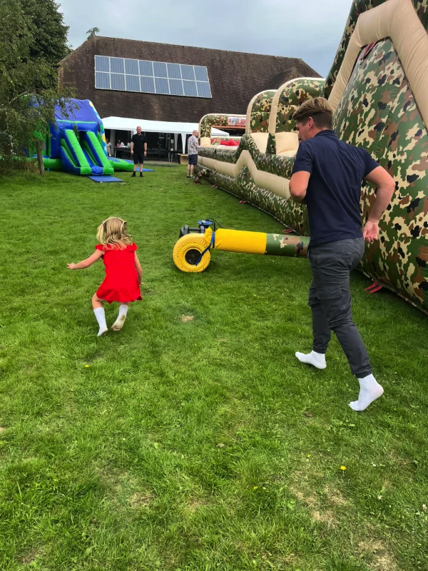 Parent and child by bouncy castle